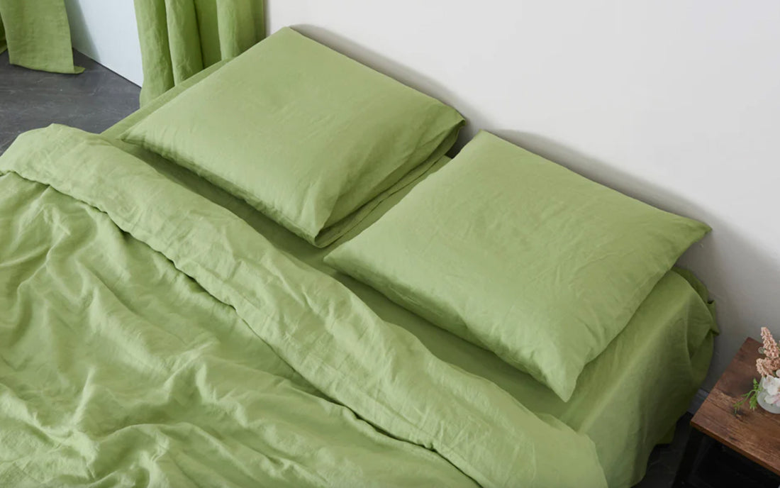 Matcha green linen sheets and pillowcases on bed