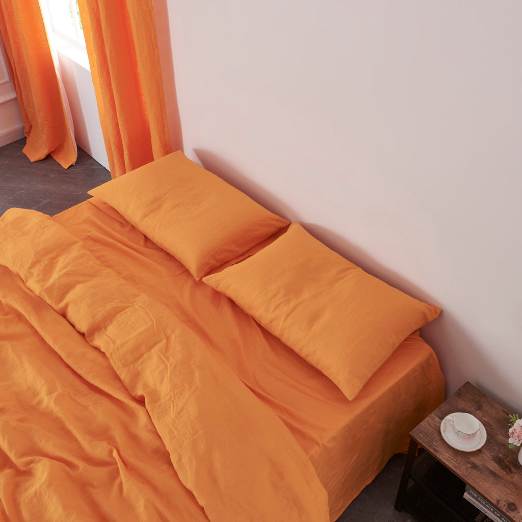 Tangelo Linen Housewife Pillowcases on Bed