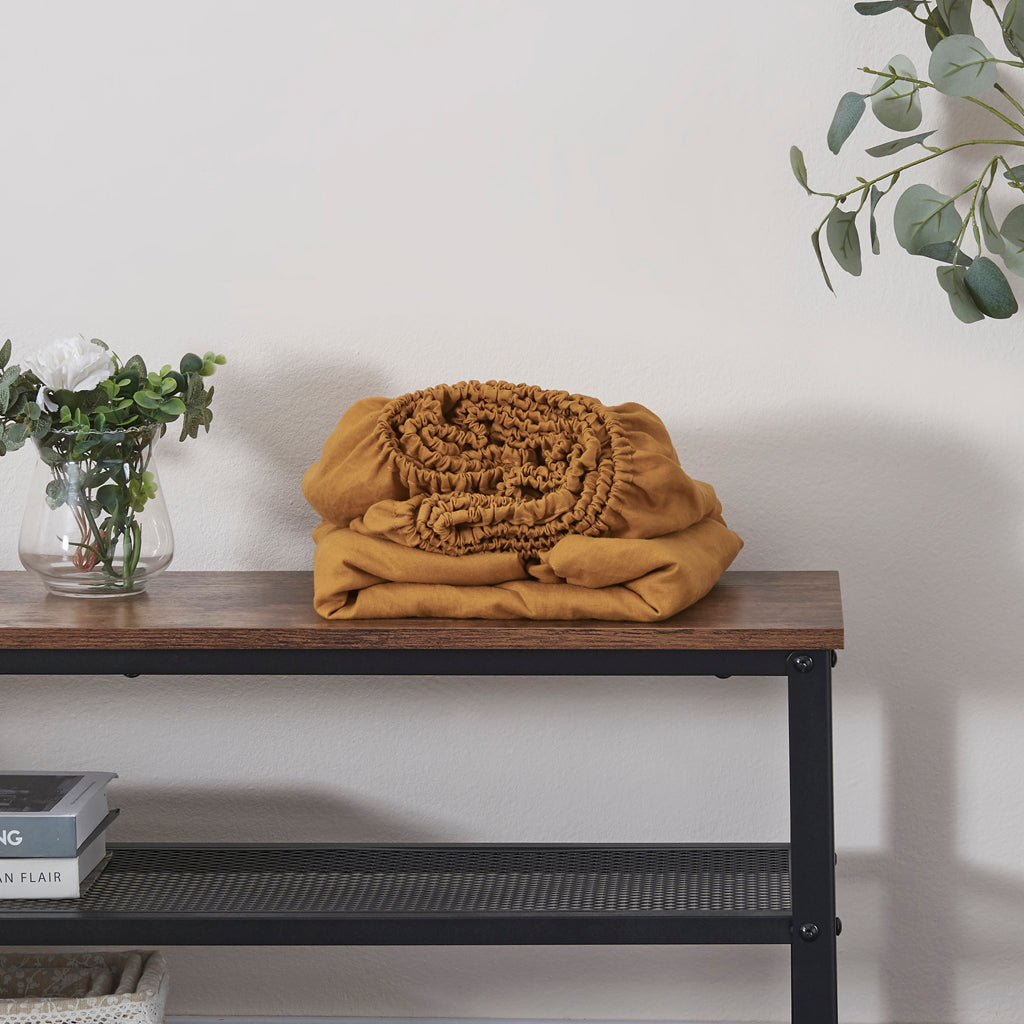 Mustard Linen Fitted Sheet Folded on Shelf
