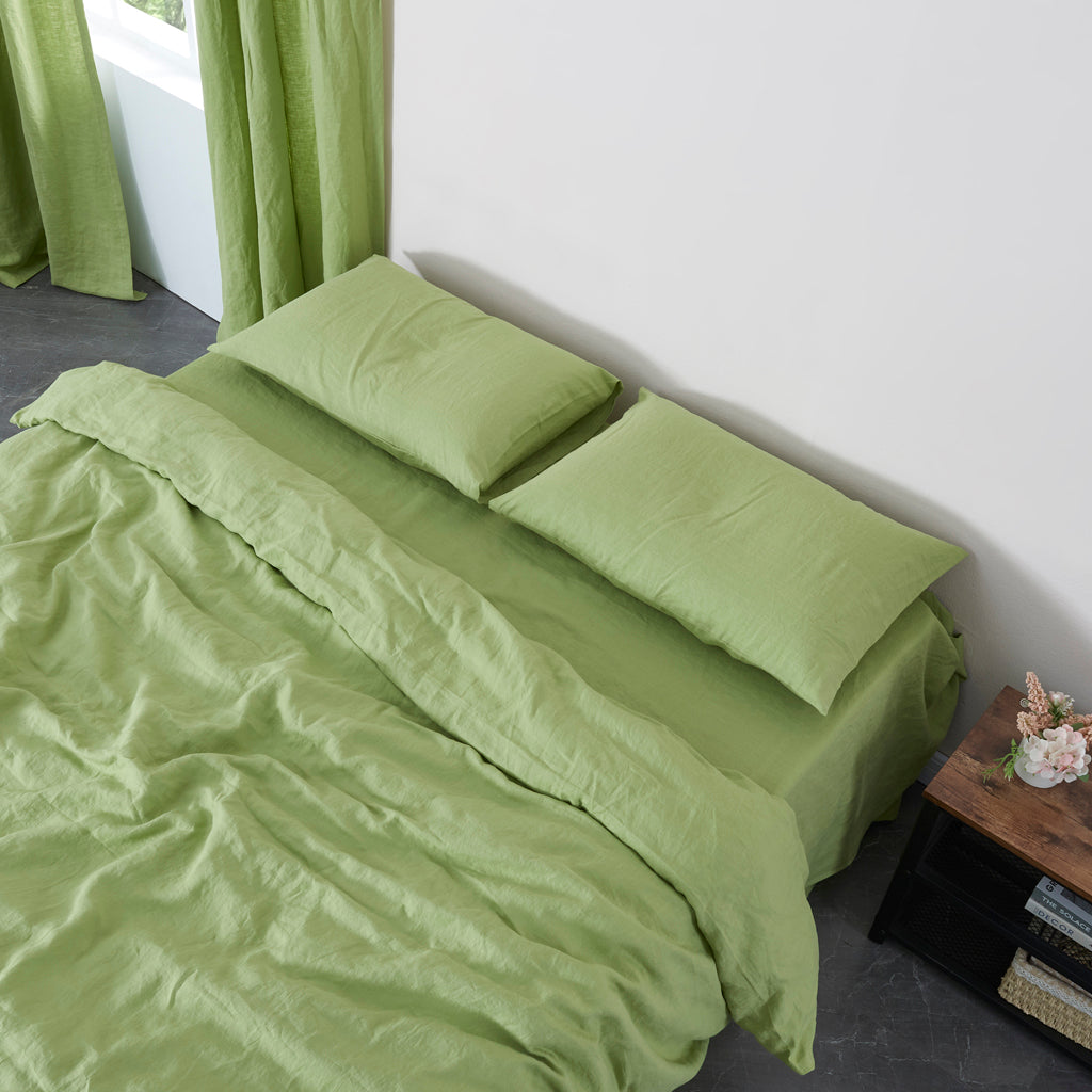Matcha Green Linen Housewife Pillowcases on Bed