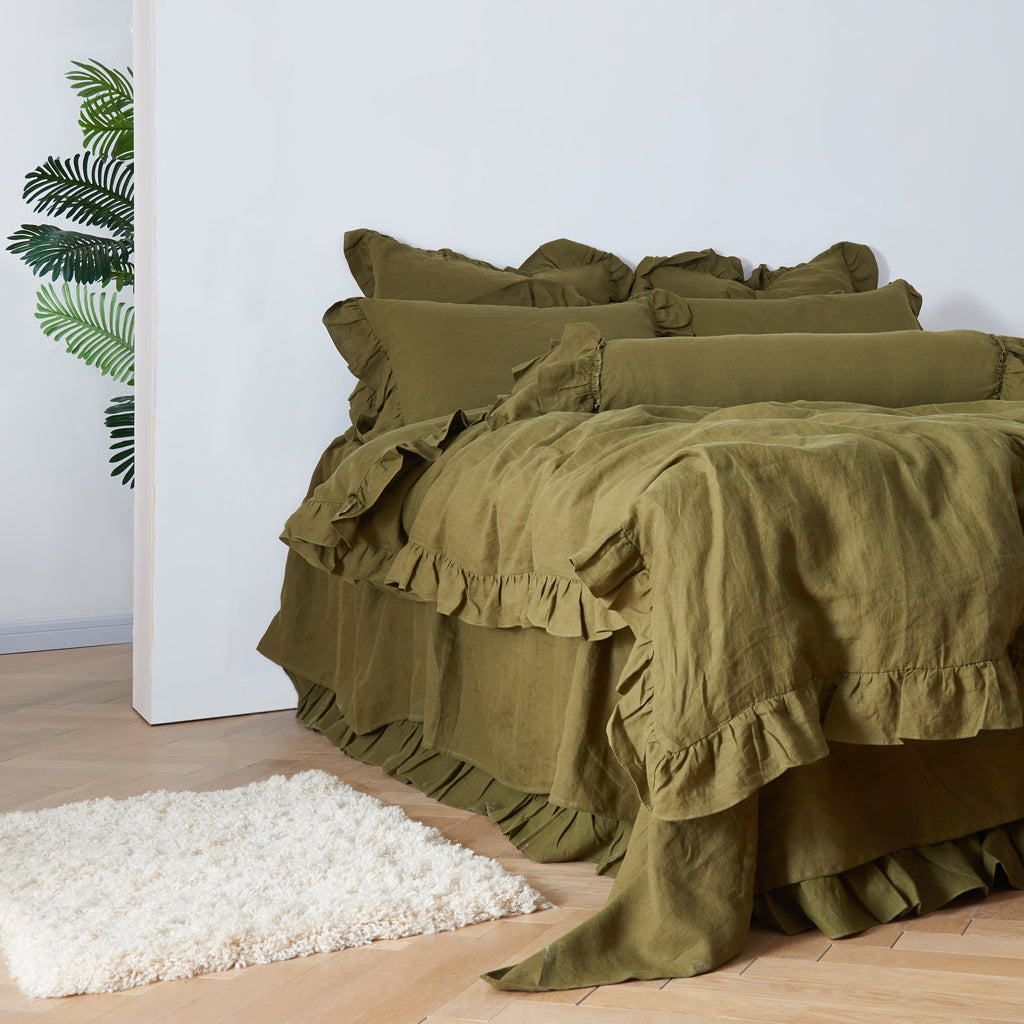 Olive Green Linen Ruffle Hem Duvet Cover on Bed