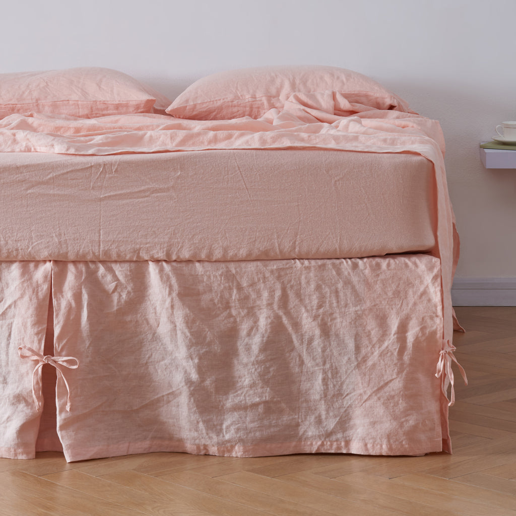 Front View Of Peach 100% Linen Side Peated Bedskirt With Knots