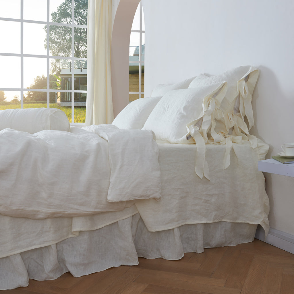 Ivory Linen Euro Pillowcases with Bow Ties on Bed