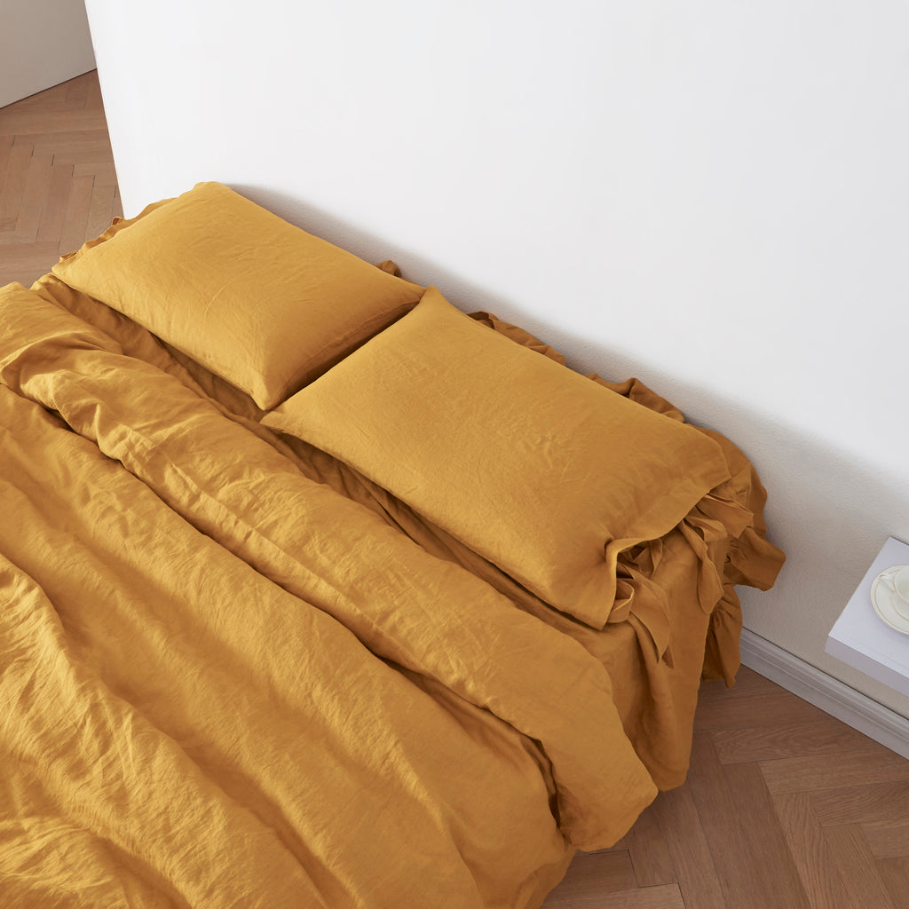 100% Linen Pillowcases with Bow Ties in Mustard Yellow on Bed