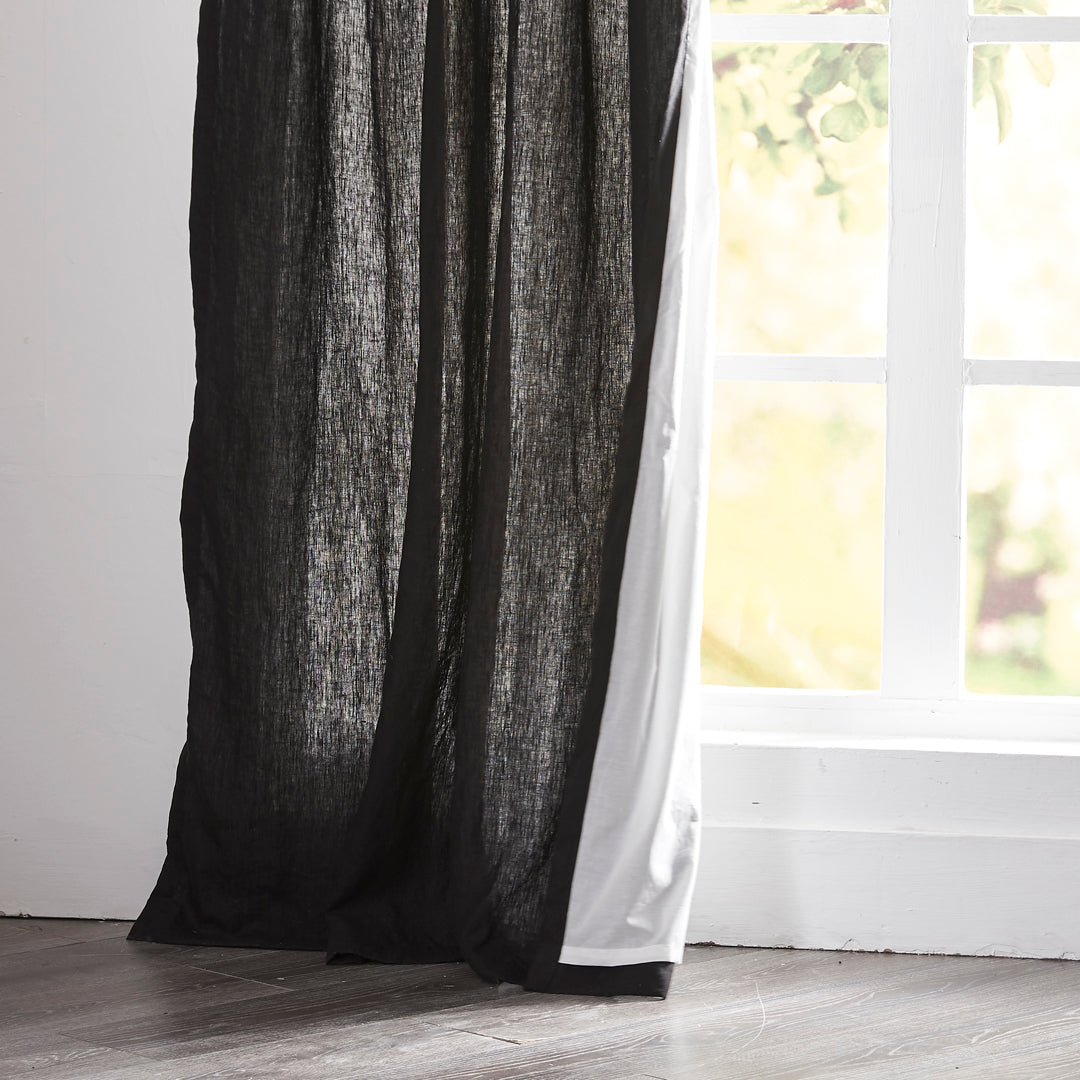 Hem of Black Linen Curtains with Cotton Lining on Window