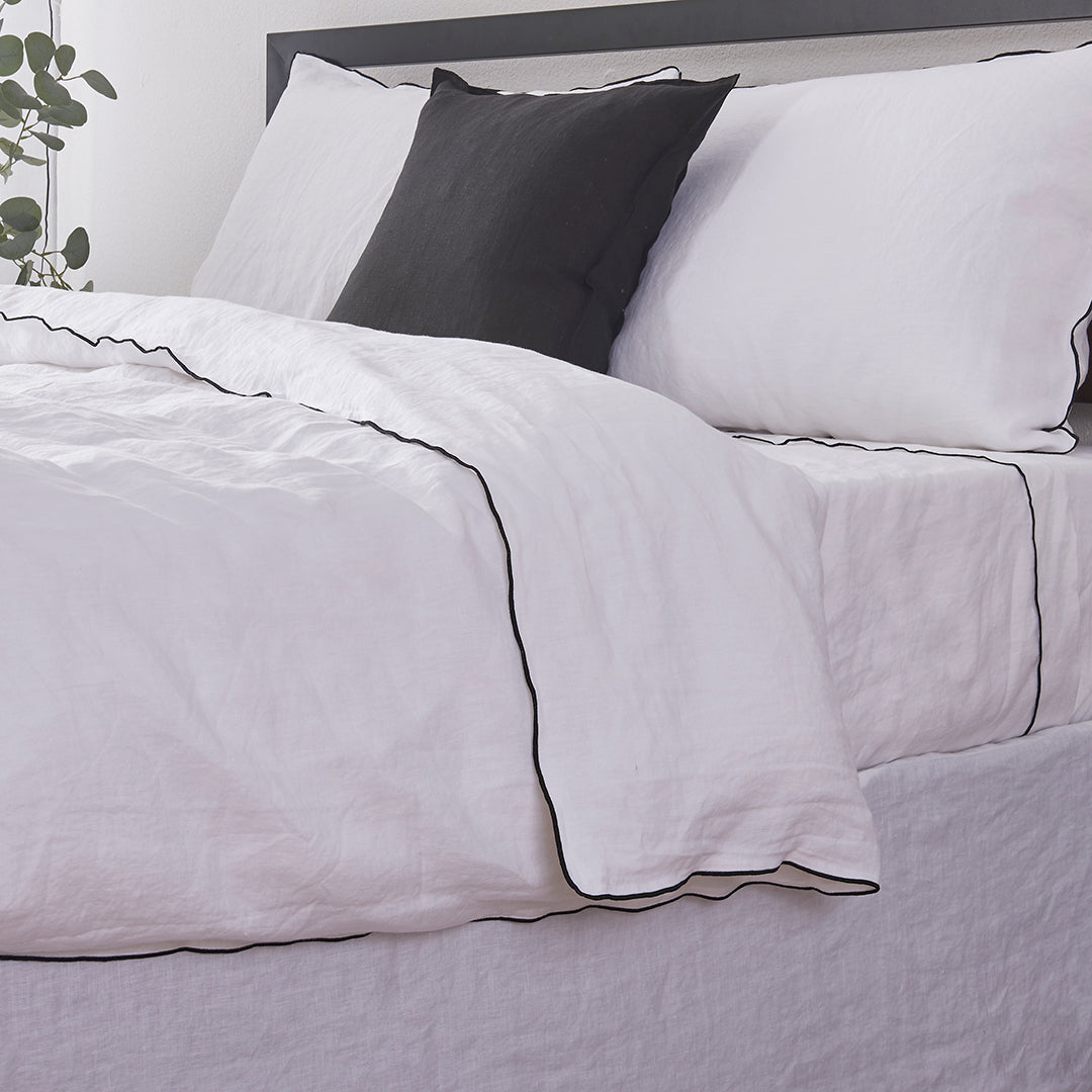Black Edge Detail on 100% Linen White Duvet Cover on Bed