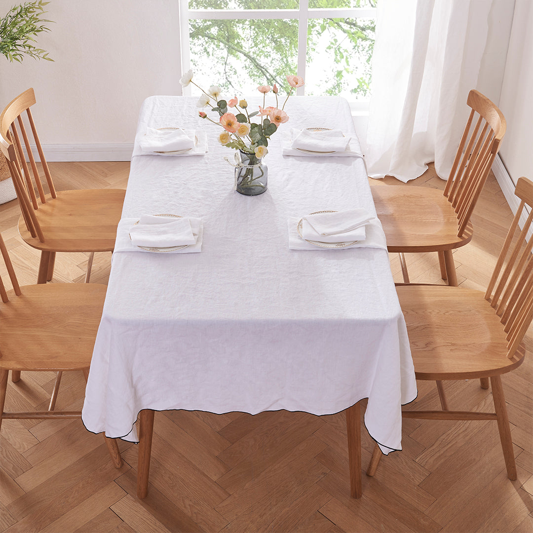 100% Linen White Tablecloth with Black Embroidered Edge on Table in Dining Room