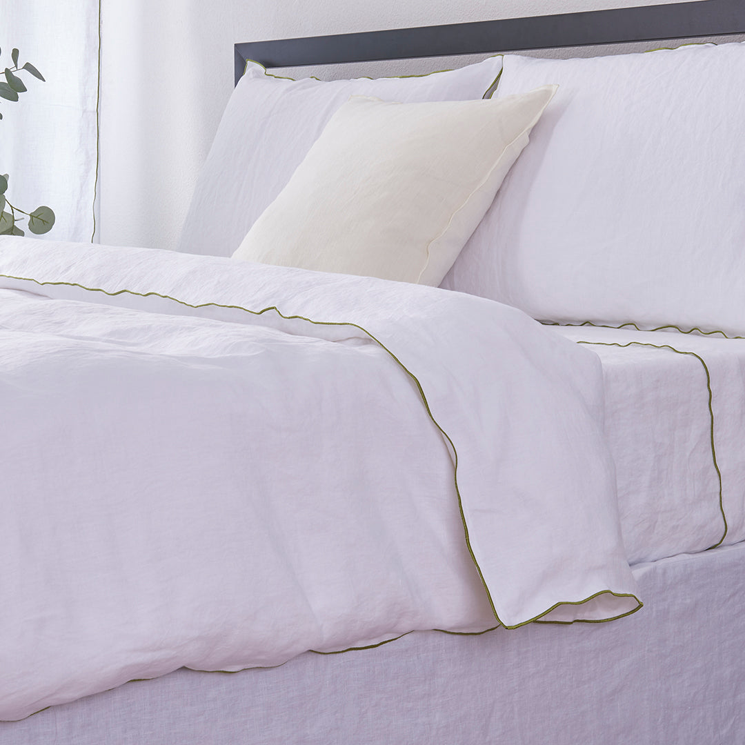 Breathable Linen Duvet Cover with Leek Green Embroidered Edge on Bed