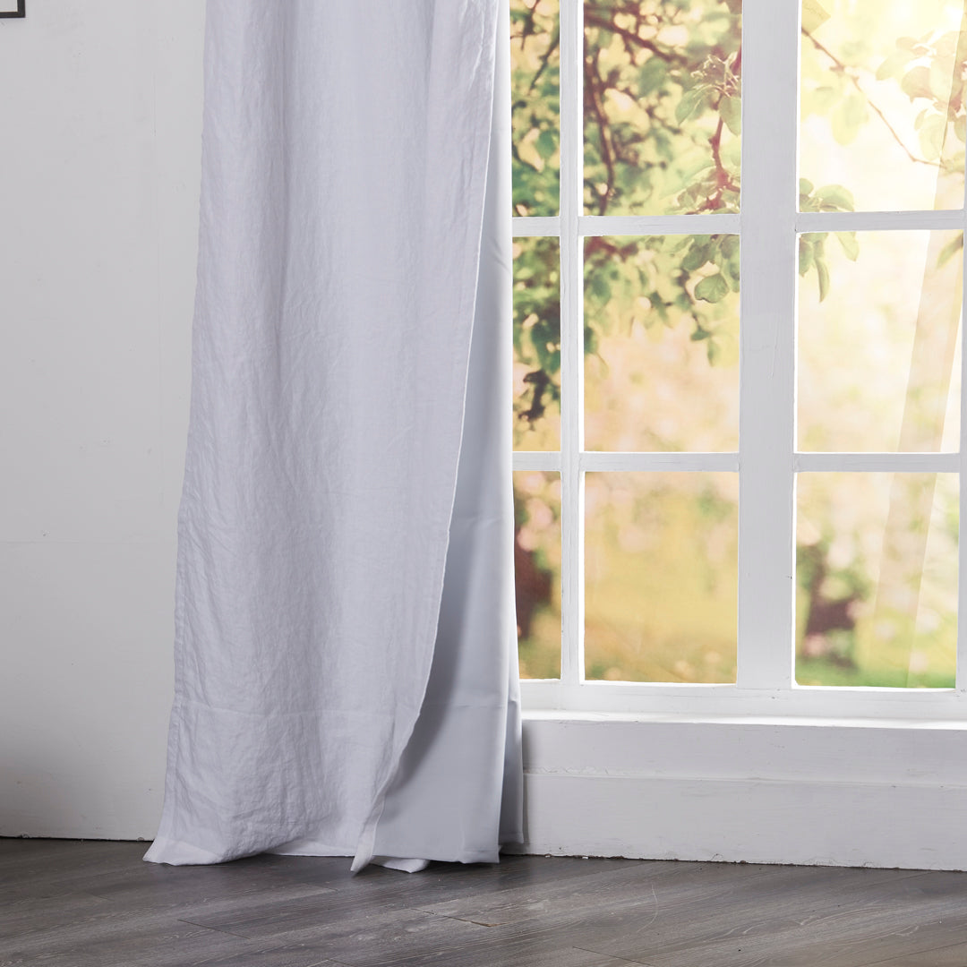 Close-up of 100% linen optic white curtain hems with blackout lining