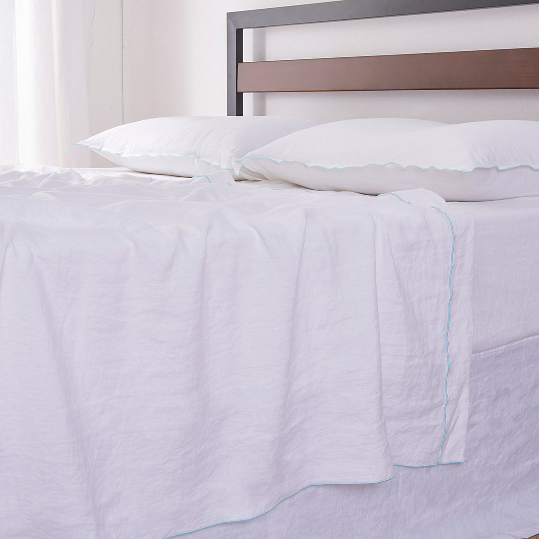 Side of White Linen Flat Sheet with Pale Blue Embroidered Edge