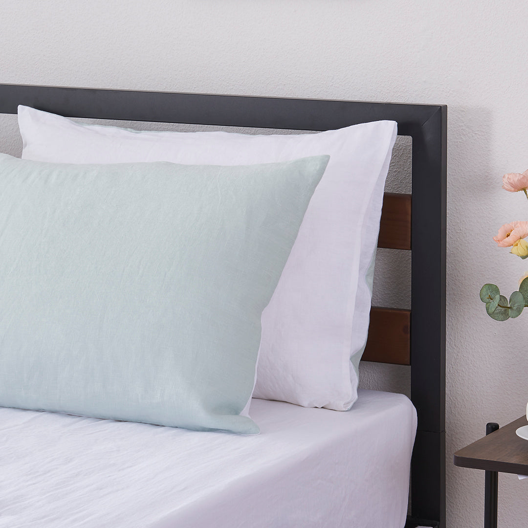 Two Pale Blue and White Linen Pillowcases on Bed