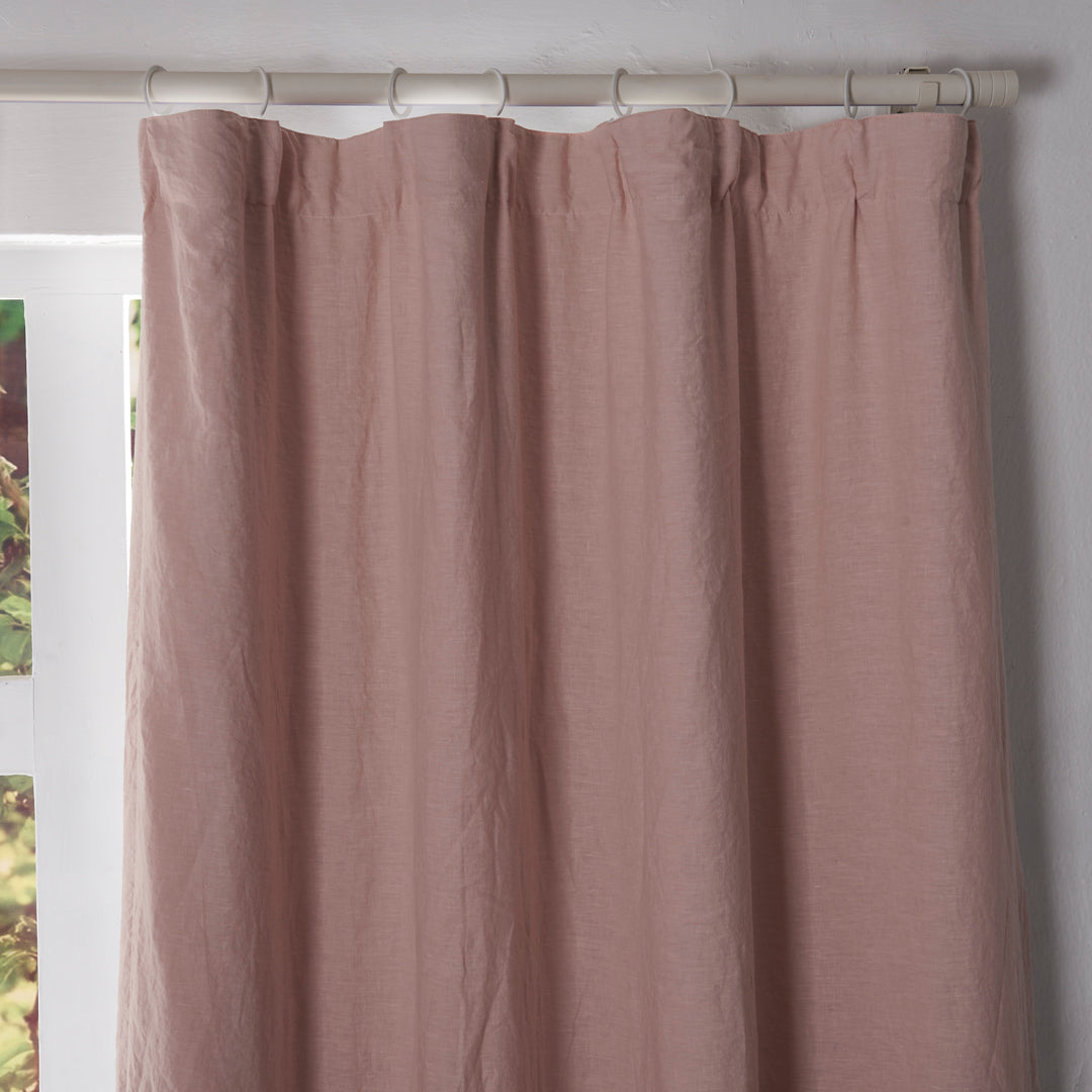 Close-up of the top of peach linen drapery