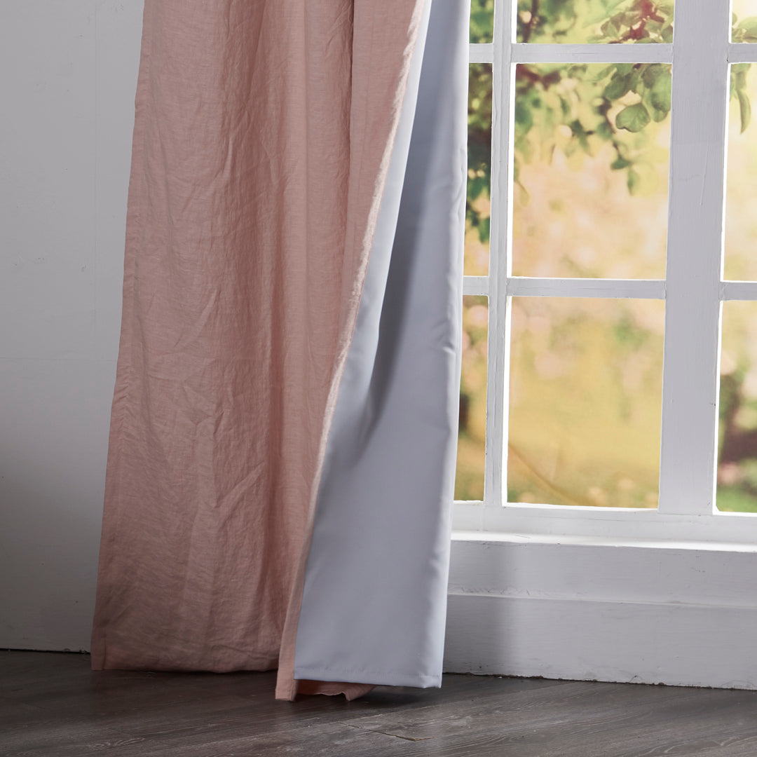 Close-up of 100% linen peach curtain hems with blackout lining