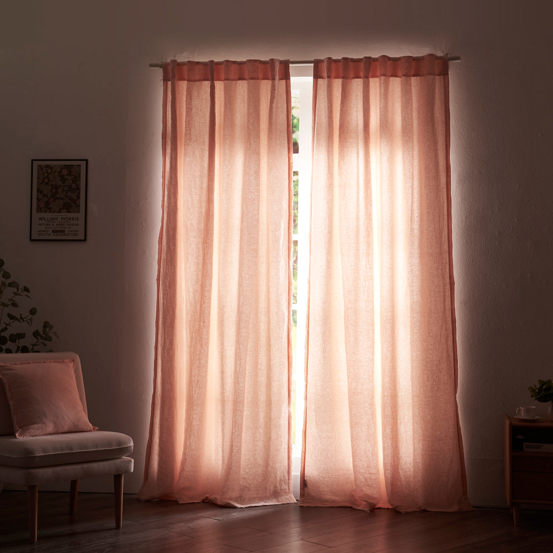 Peach linen drapery with cotton lining drawn closed over windows