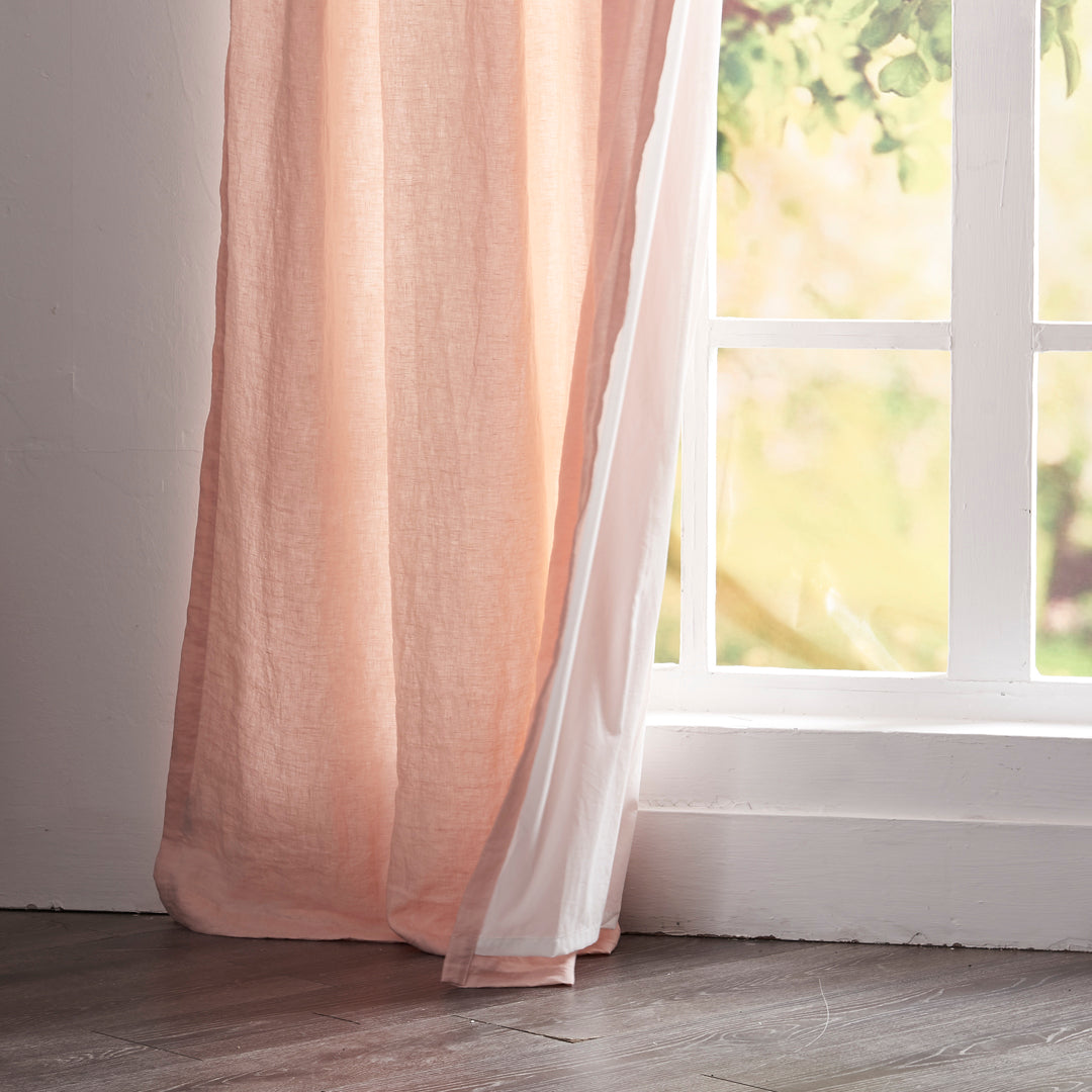 Close-up of 100% linen peach curtain hems with cotton lining