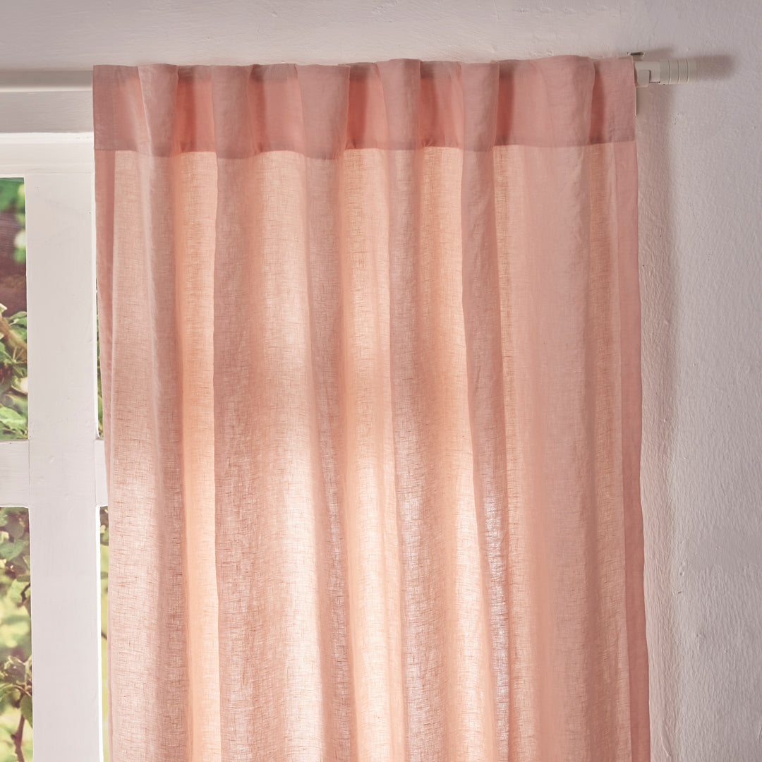 Close-up of the top of peach linen drapery