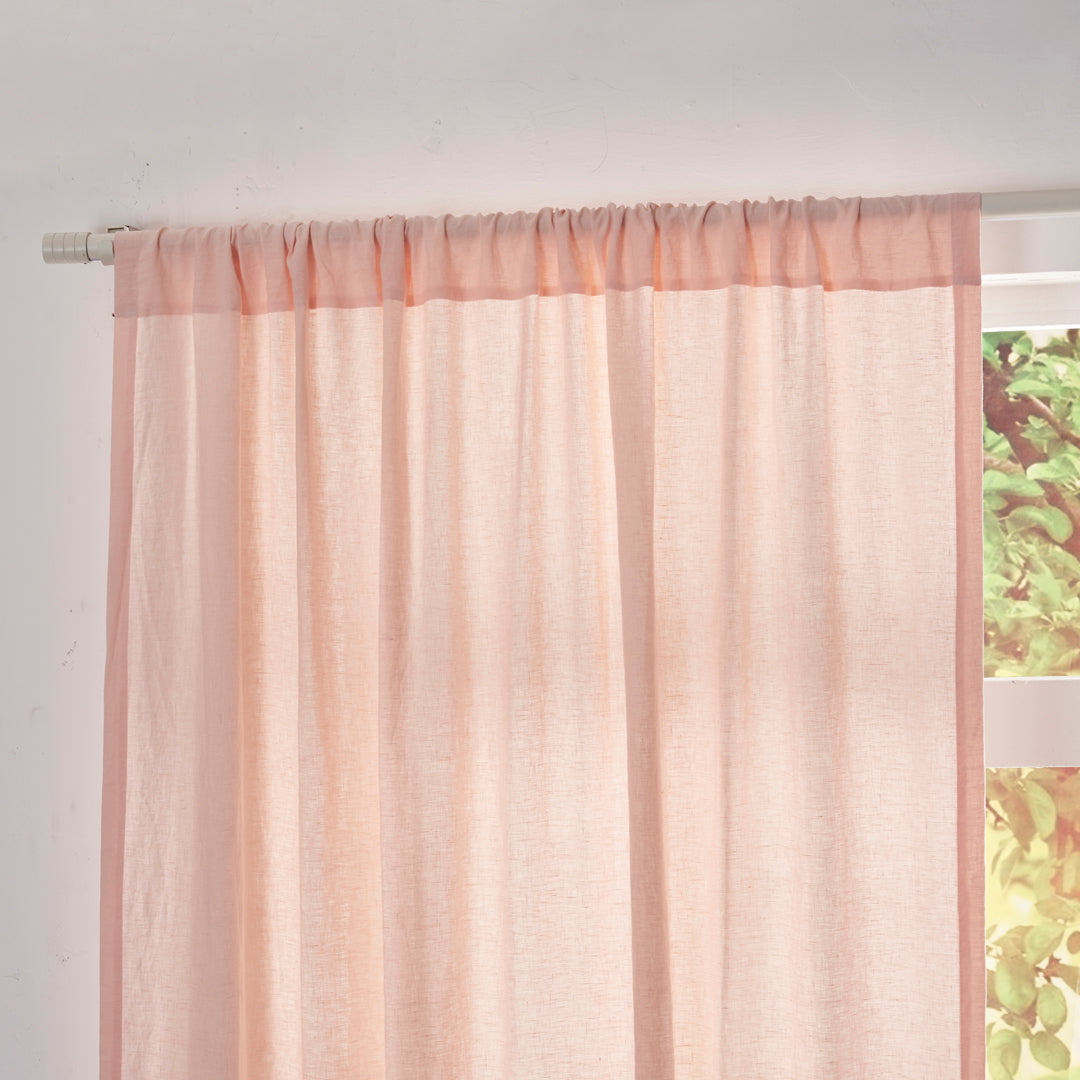 Close-up of the top of peach linen drapery