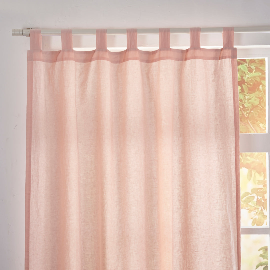 Close-up of the top of peach linen drapery