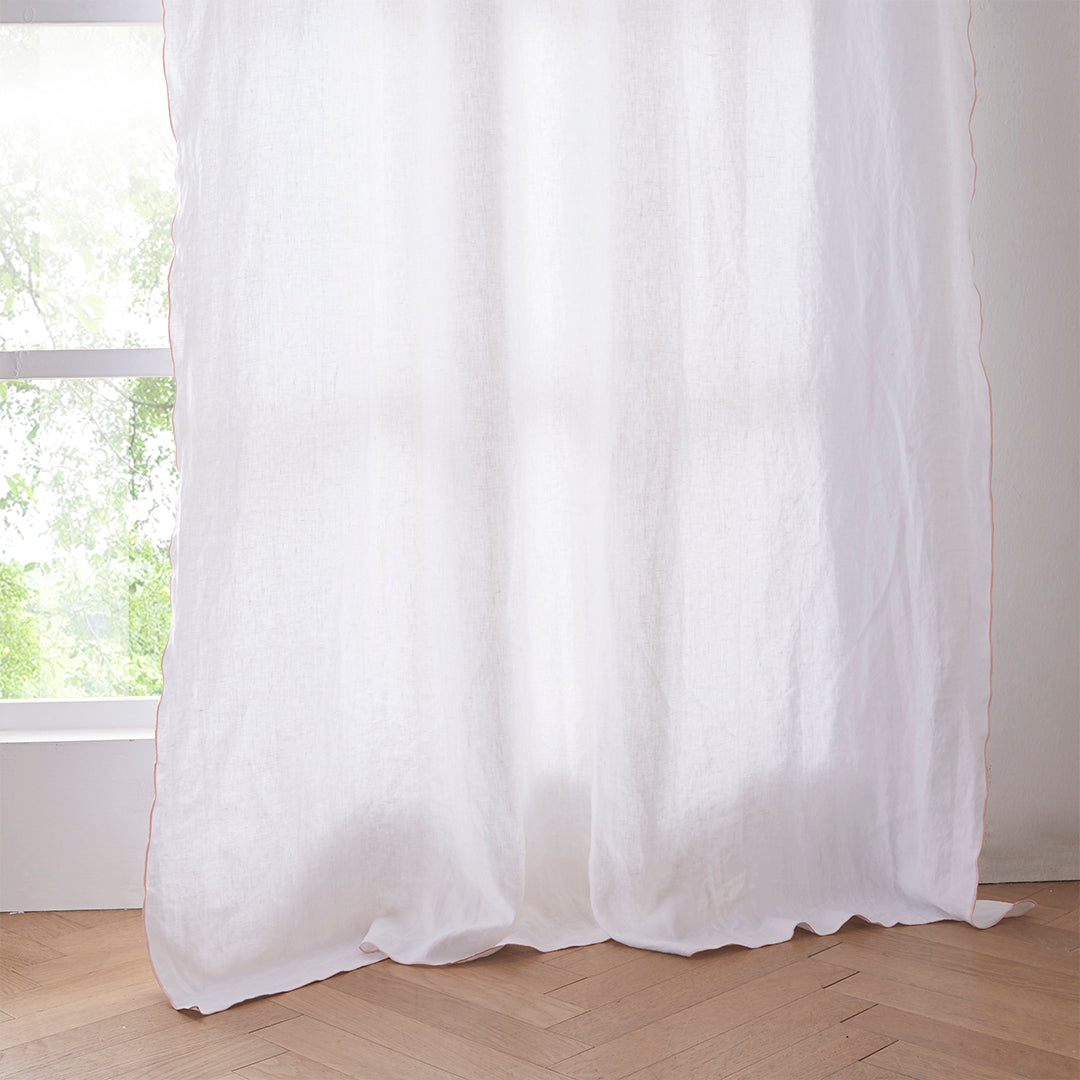 Hem of White Linen Curtain with Embroidered Peach Edge
