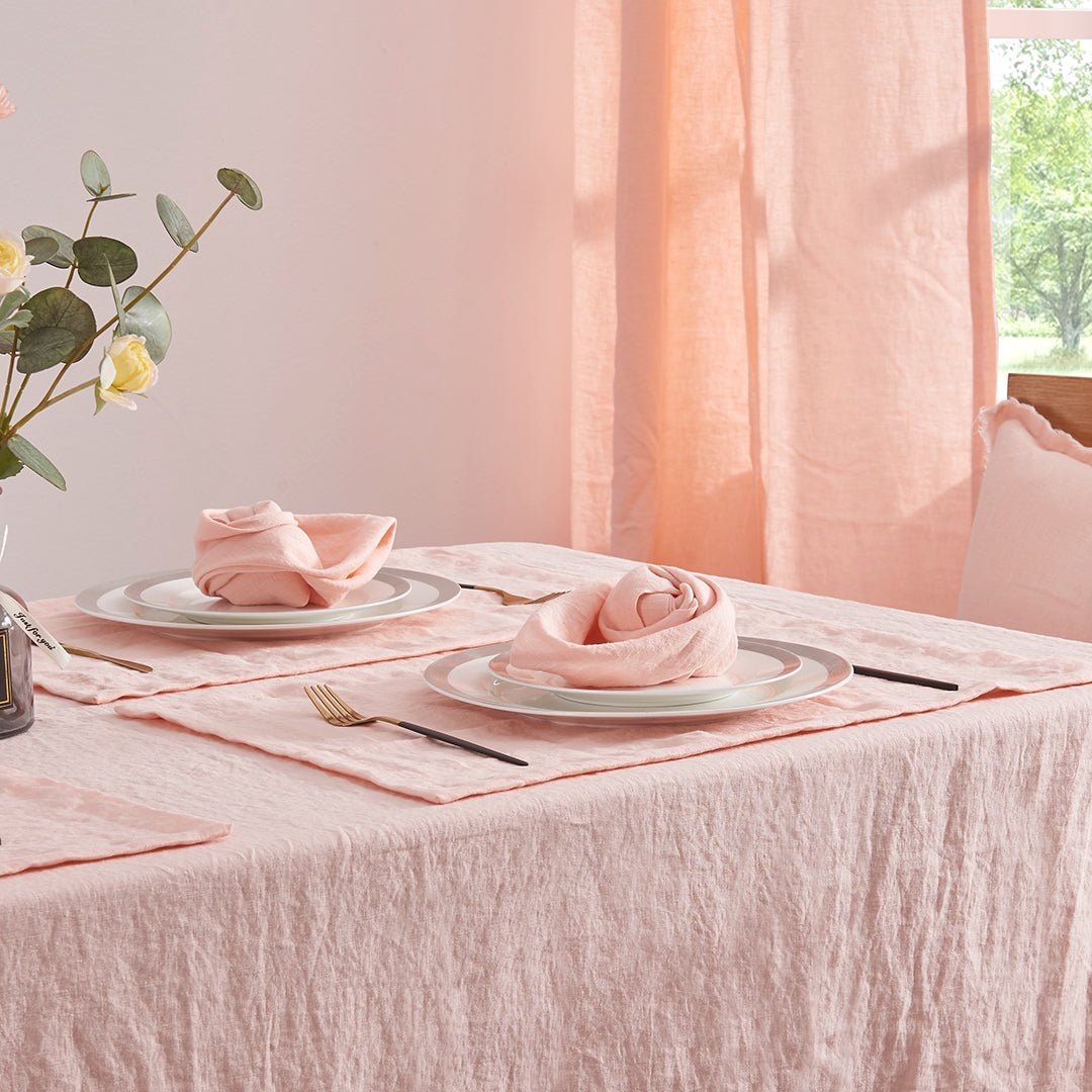 100% linen peach table napkins set on dinner plates