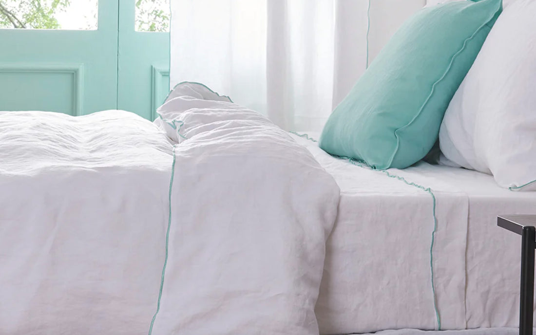 Aqua Edge Embroidered Linen Duvet Cover on bed