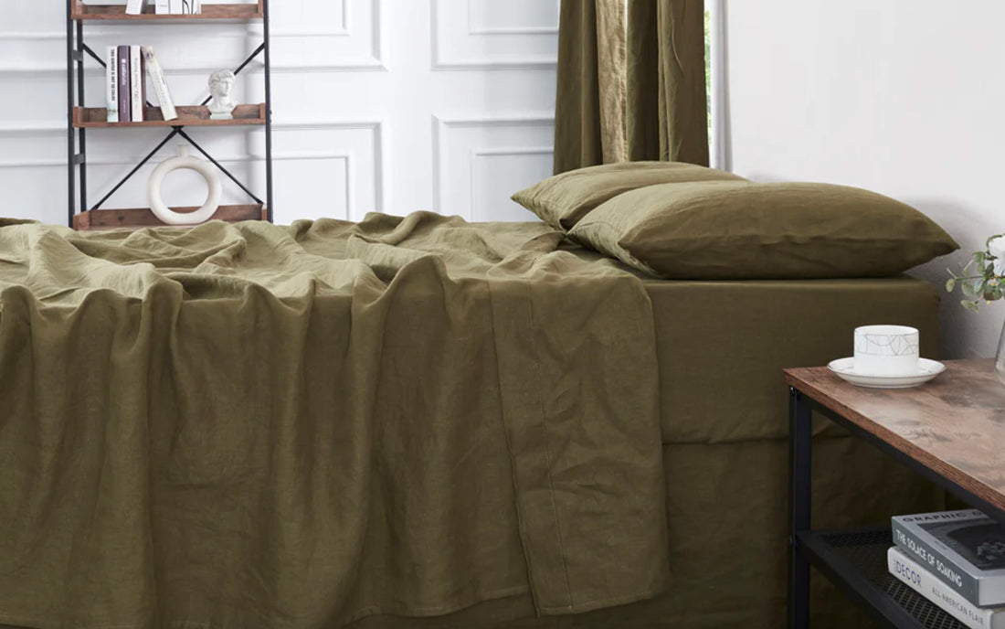 Bed with olive green linen sheet set