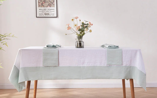 Pale Blue Color Bordered Linen Tablecloth on table with coordinating napkins