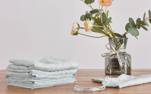 Pale Blue Linen Napkins Folded on Dining Table