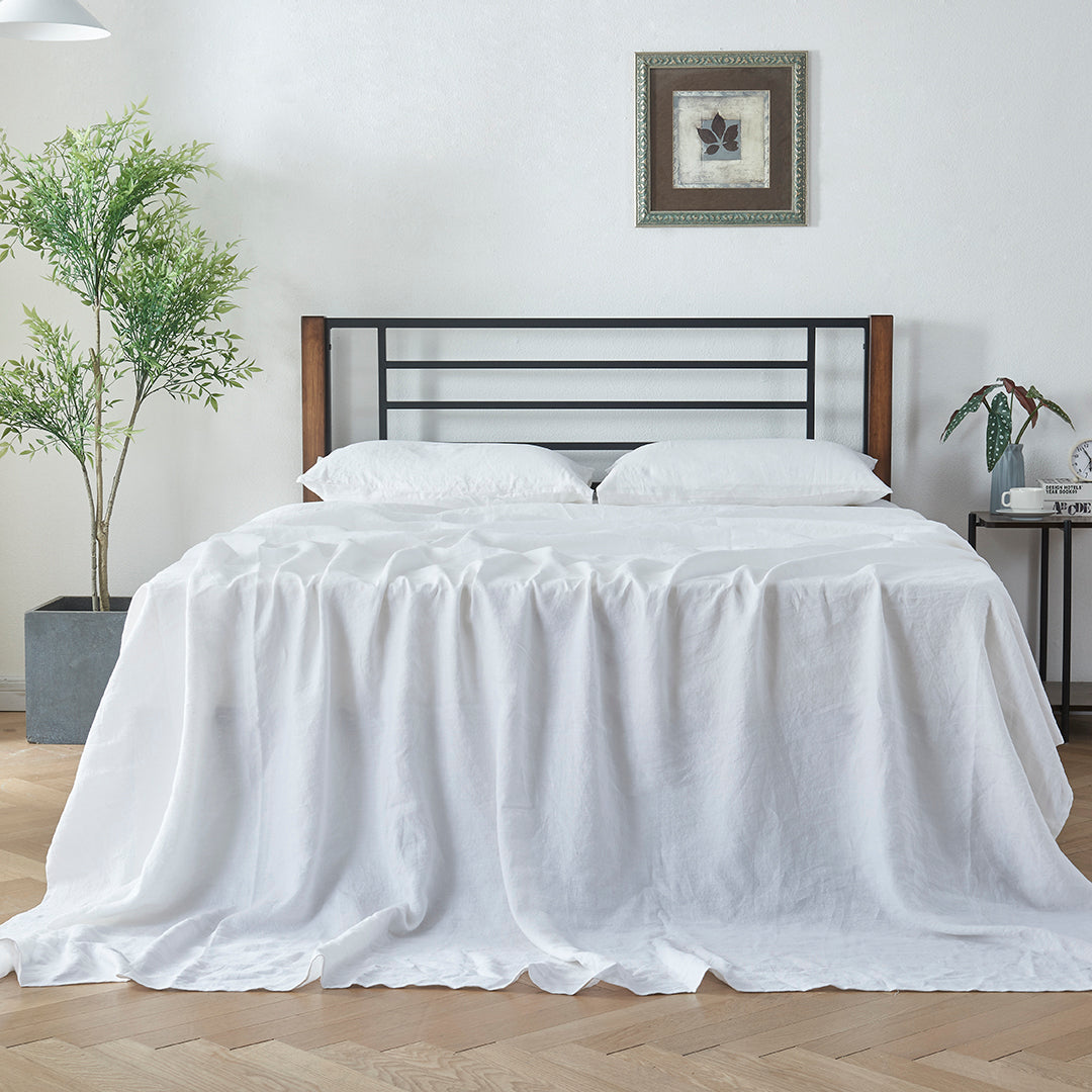White Linen Sheet on Bed