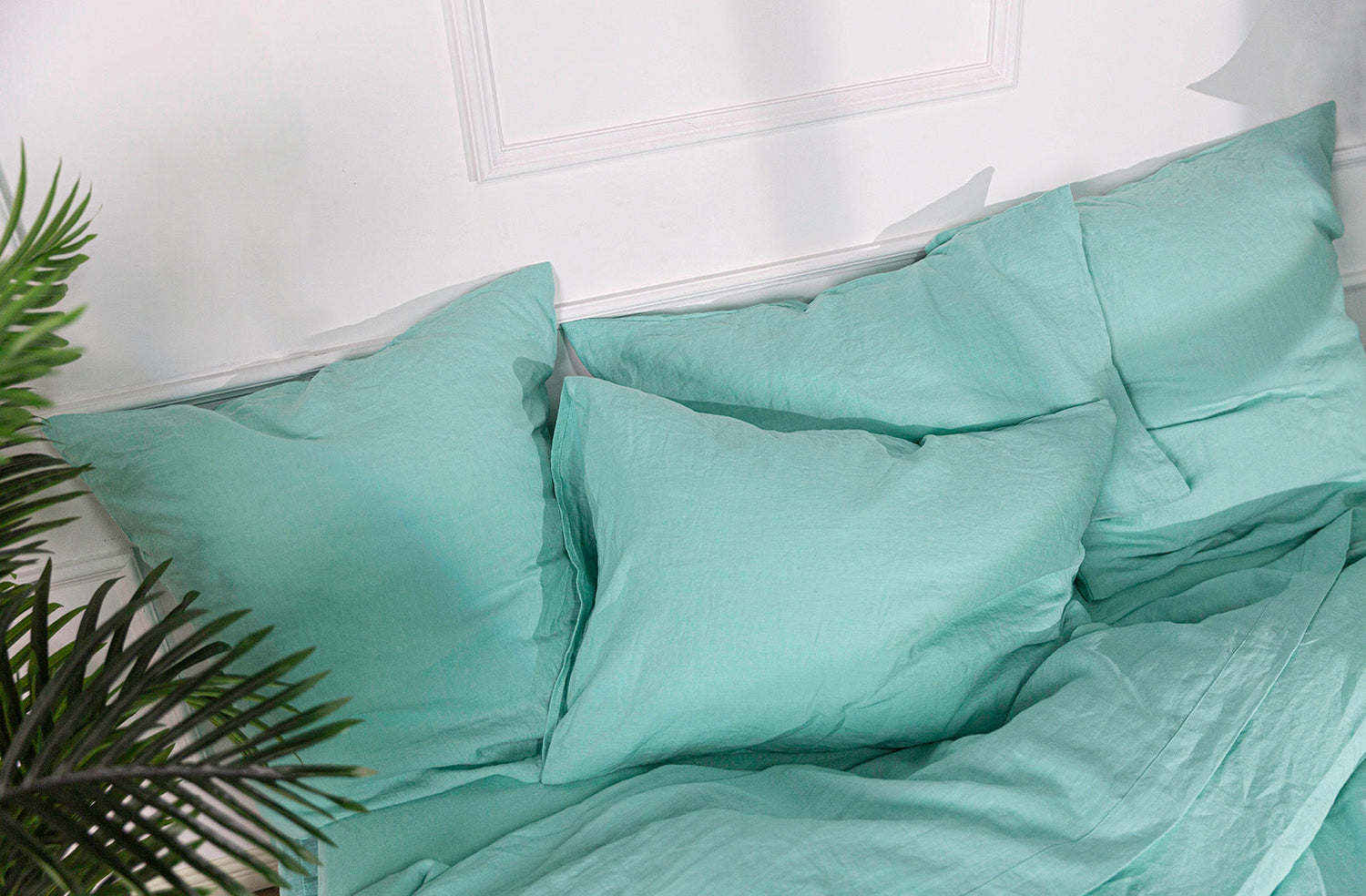 Aqua Linen Cooling Pillowcases on Bed
