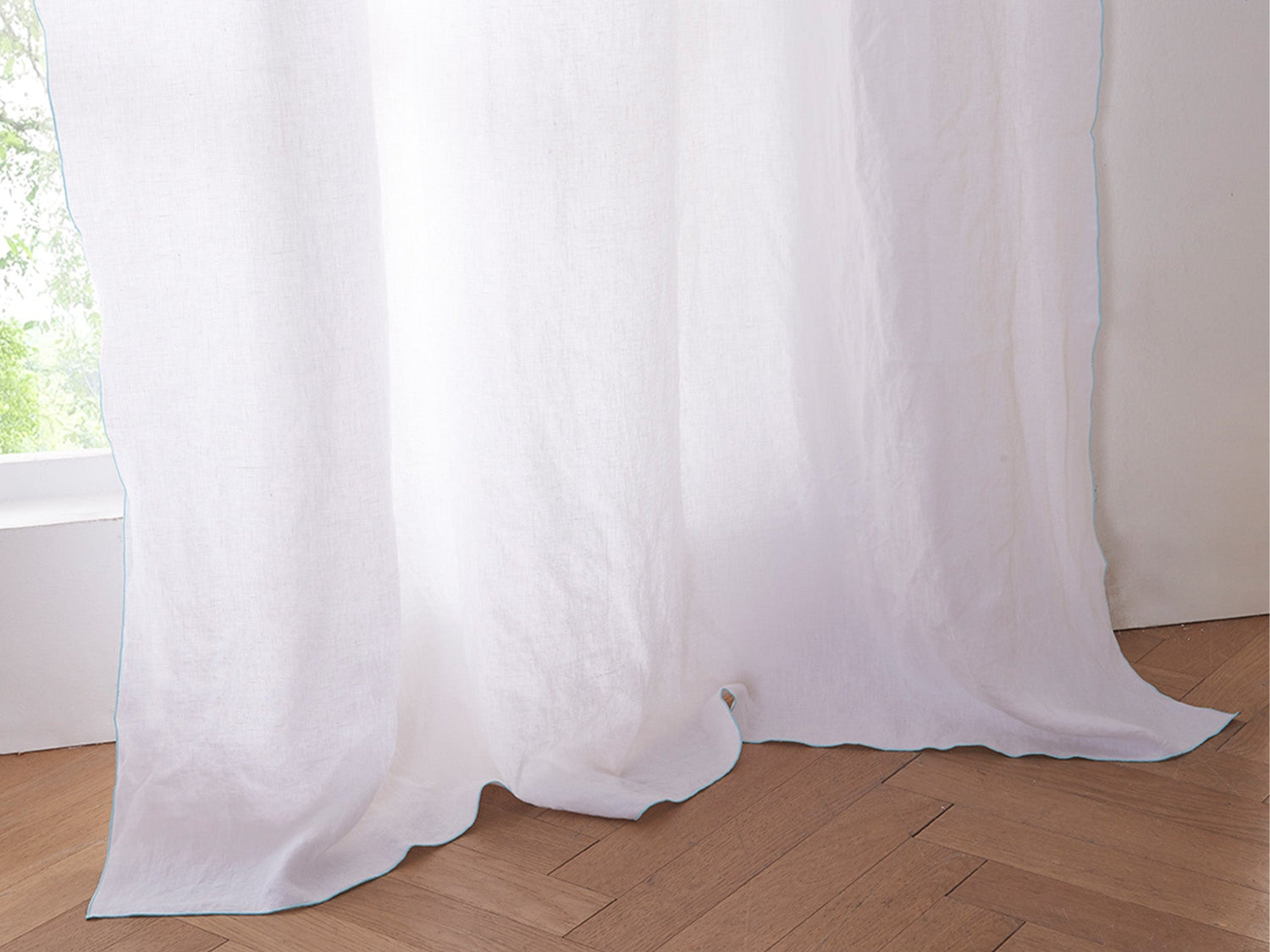 White Linen Curtain with Blue Embroidered Edge on Window