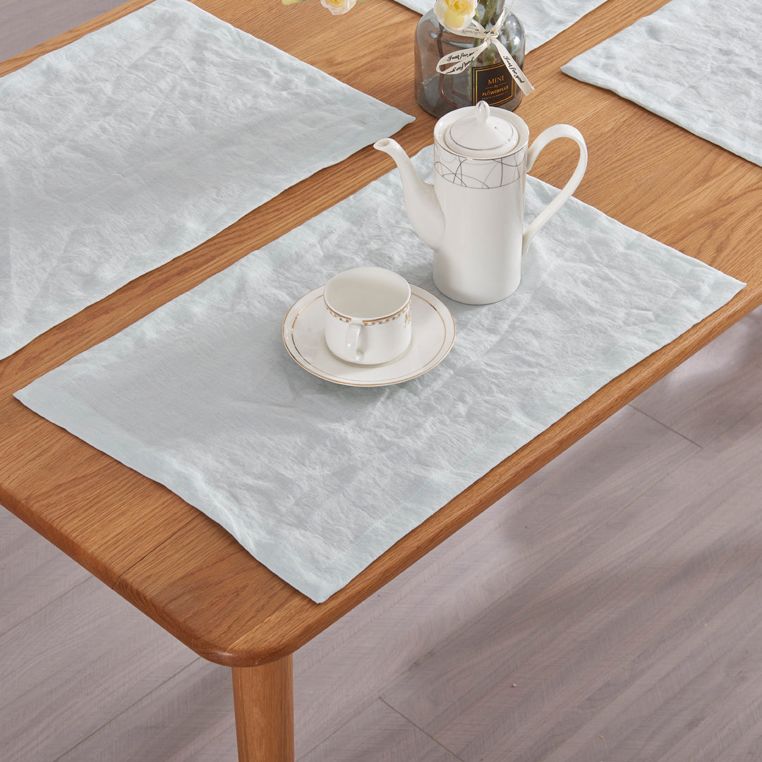 Pure linen placemats set on a table with ceramic tea set.