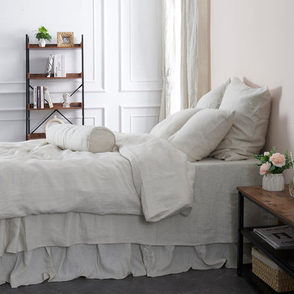 Cool Gray Linen Bolster Pillow with Bow Ties on Bed