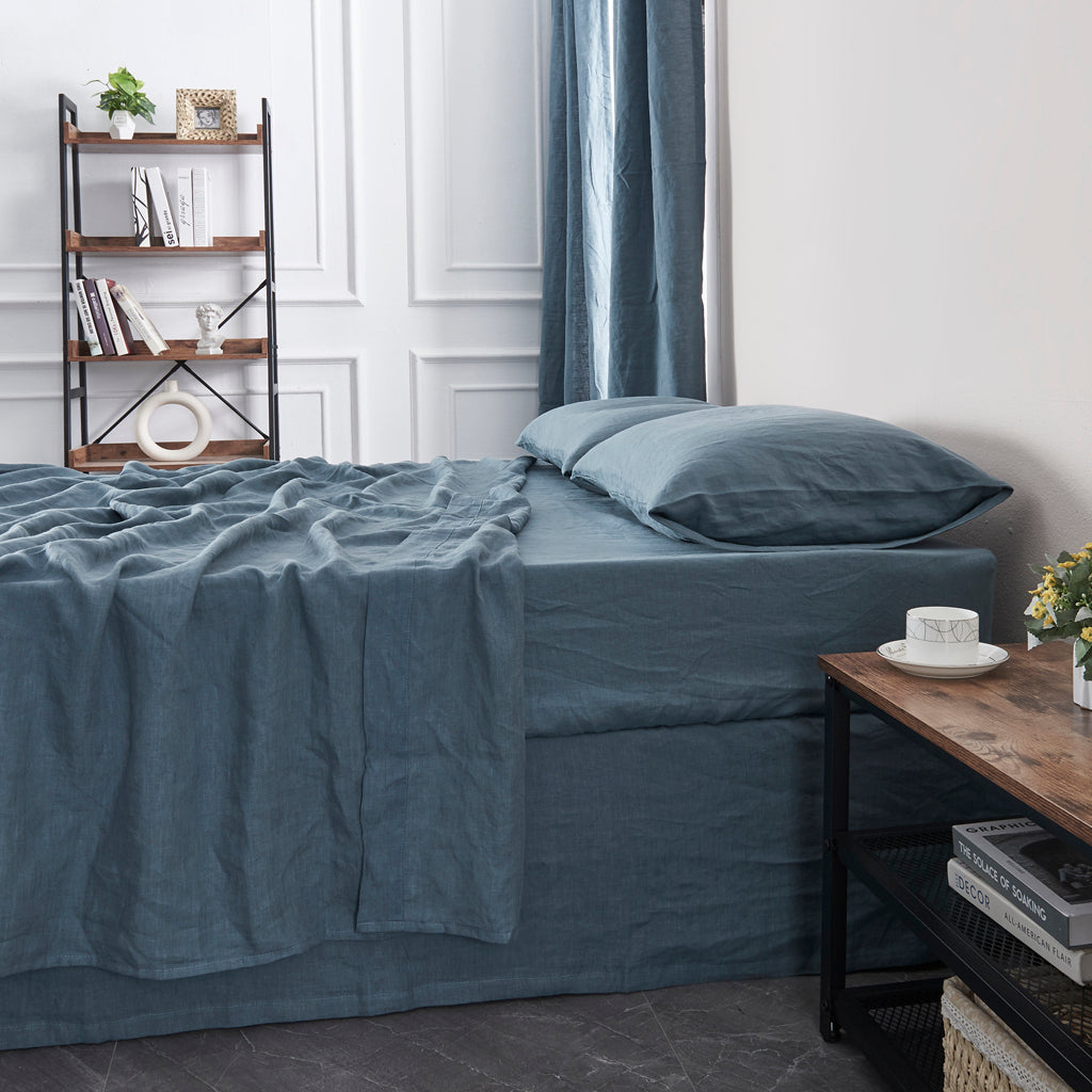 Close Up Of French Blue Linen Flat Sheet on Bed