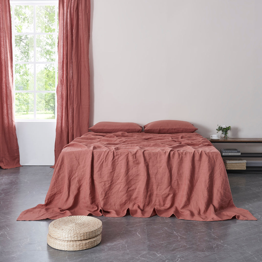 Rust Red 100% Linen Flat Sheet On a Bed - linenforce