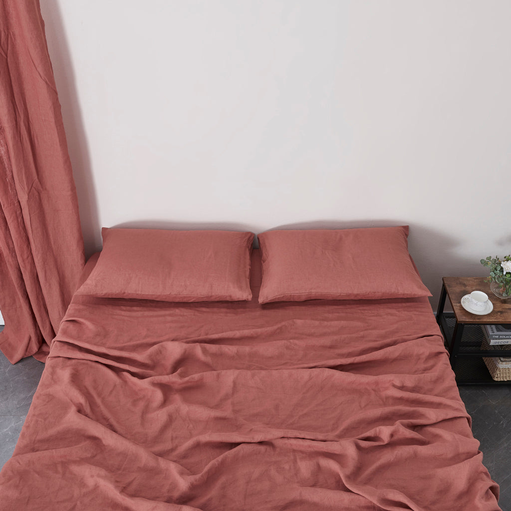 Rust Red 100% Linen Sheet Set on Bed - linenforce