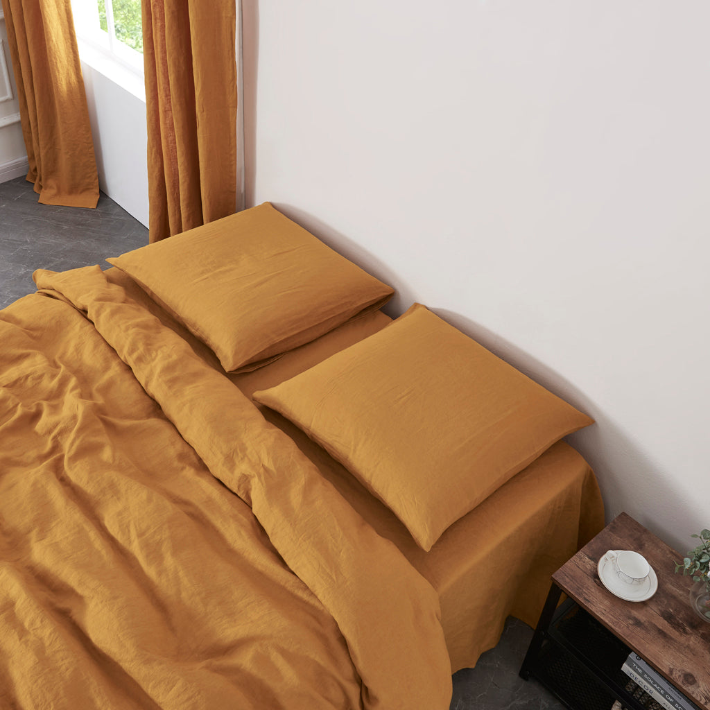 Mustard Yellow Linen Pillowcases on Bed