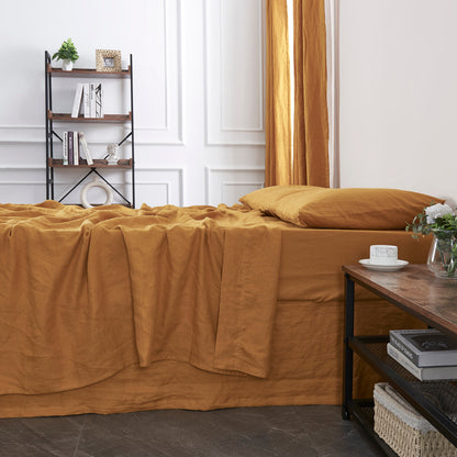 Close Up Of 100% Linen Mustard Yellow Sheet on Bed