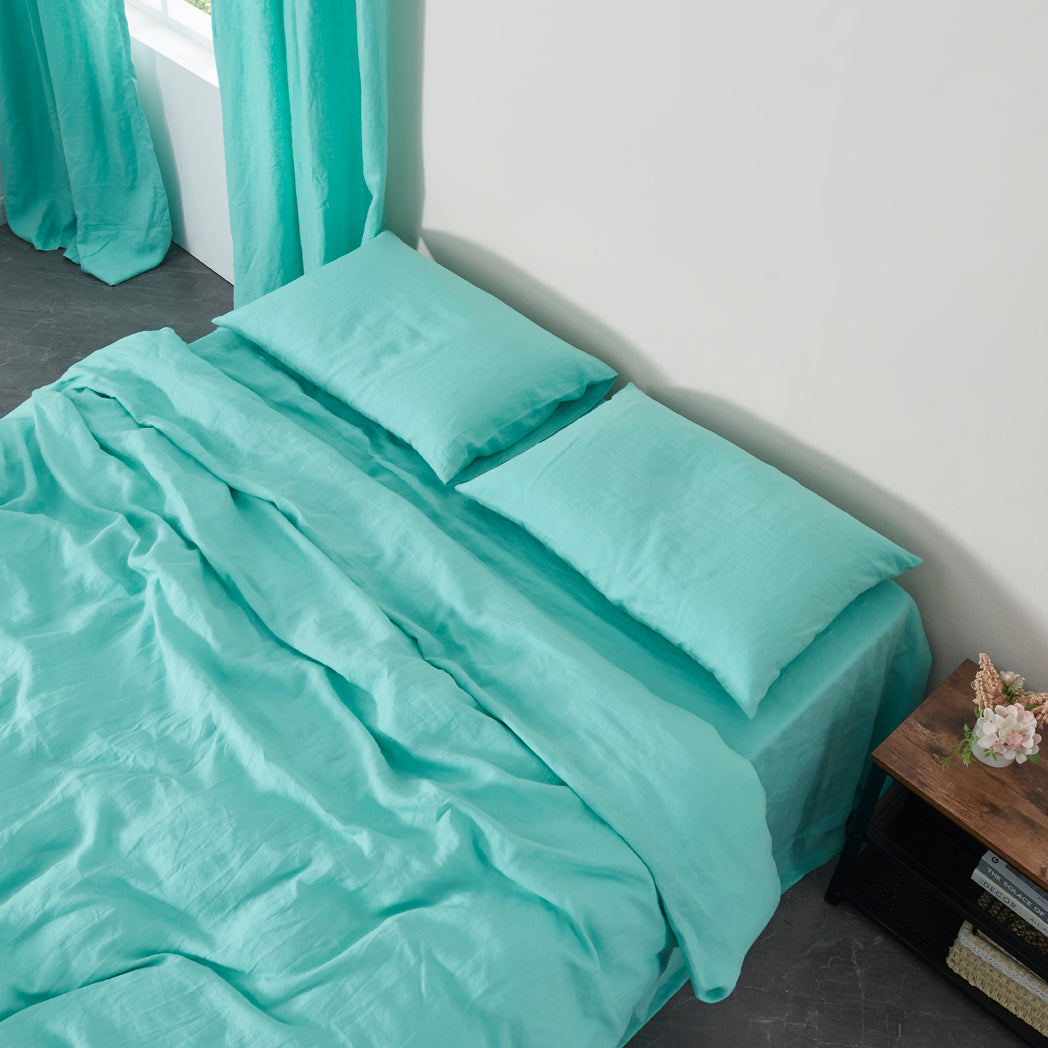 Aqua Green Linen Housewife Pillowcases on Bed