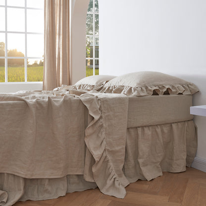 Natural Linen Ruffle Hem Flat Sheet and Pillowcases on Bed