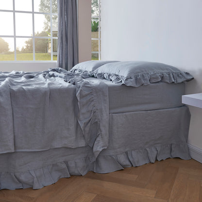 Alloy Gray Linen Flat Sheet with Ruffle Hem on Bed