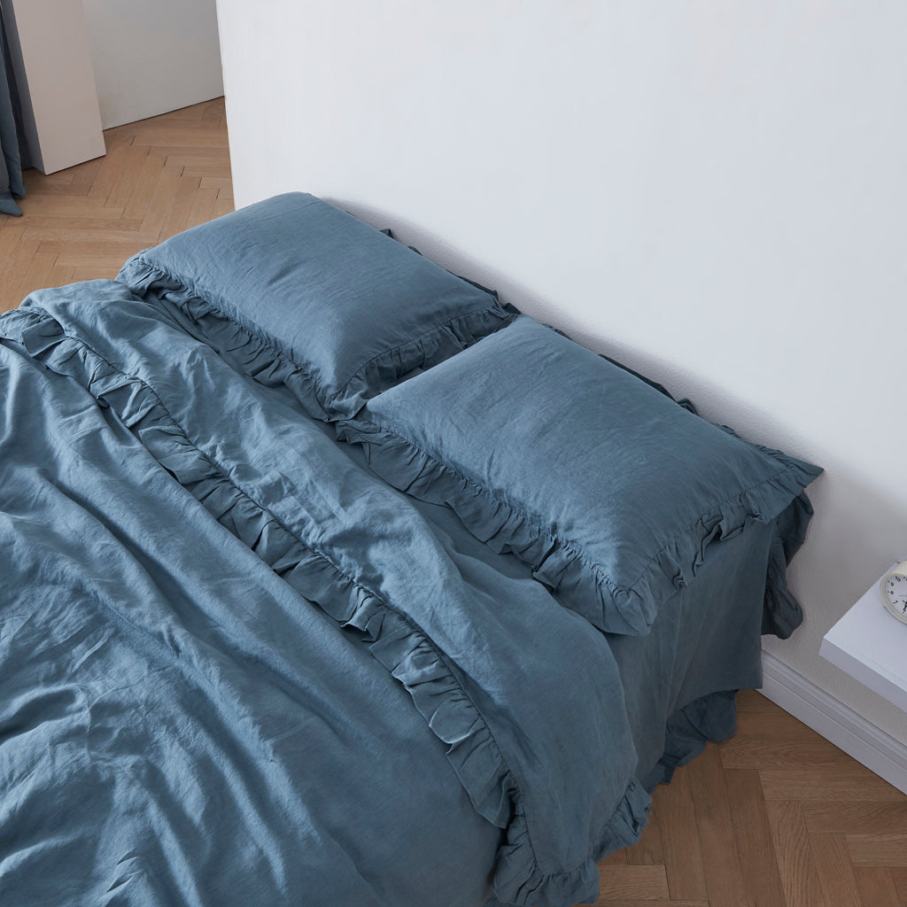 French Blue Linen Ruffle Hem Pillowcases on Bed