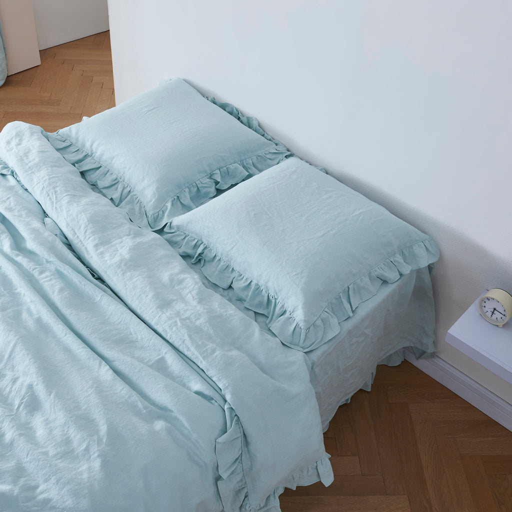 Pale Blue 100% Linen Ruffle Hem Euro Pillowcases On Bed - linenforce
