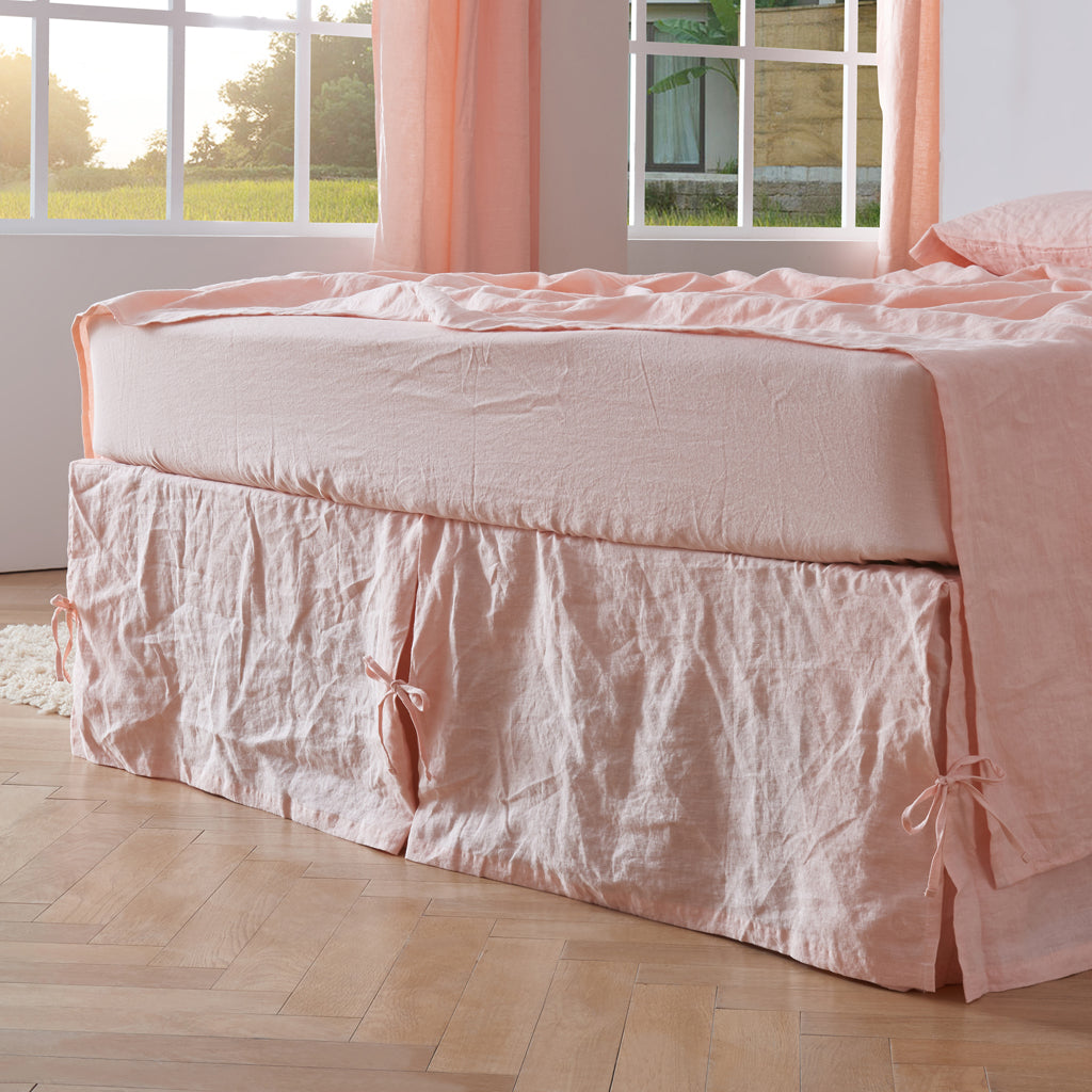 Side View Of Peach 100% Linen Side Pleated Bedskirt With Knots - linenforce