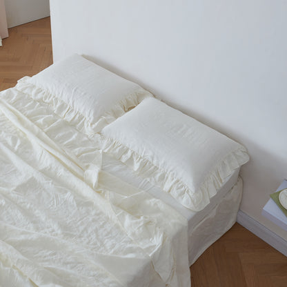 Ivory Linen Ruffle Pillowcases on Bed