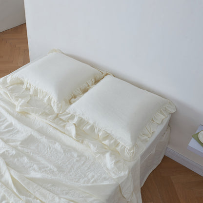 Ivory Linen Ruffle Shams on Bed