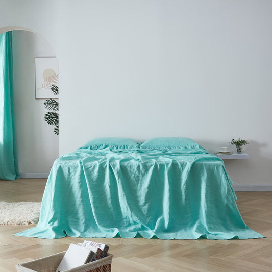 Front View Of Aqua Green 100% Linen Ruffle Hem Flat Sheet On Bed - linenforce