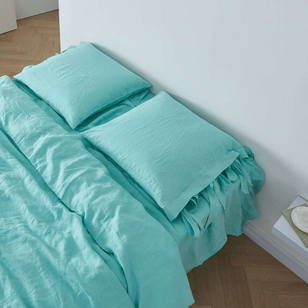 Aqua Green 100% Linen Bow Ties Euro Pillowcases On Bed - linenforce