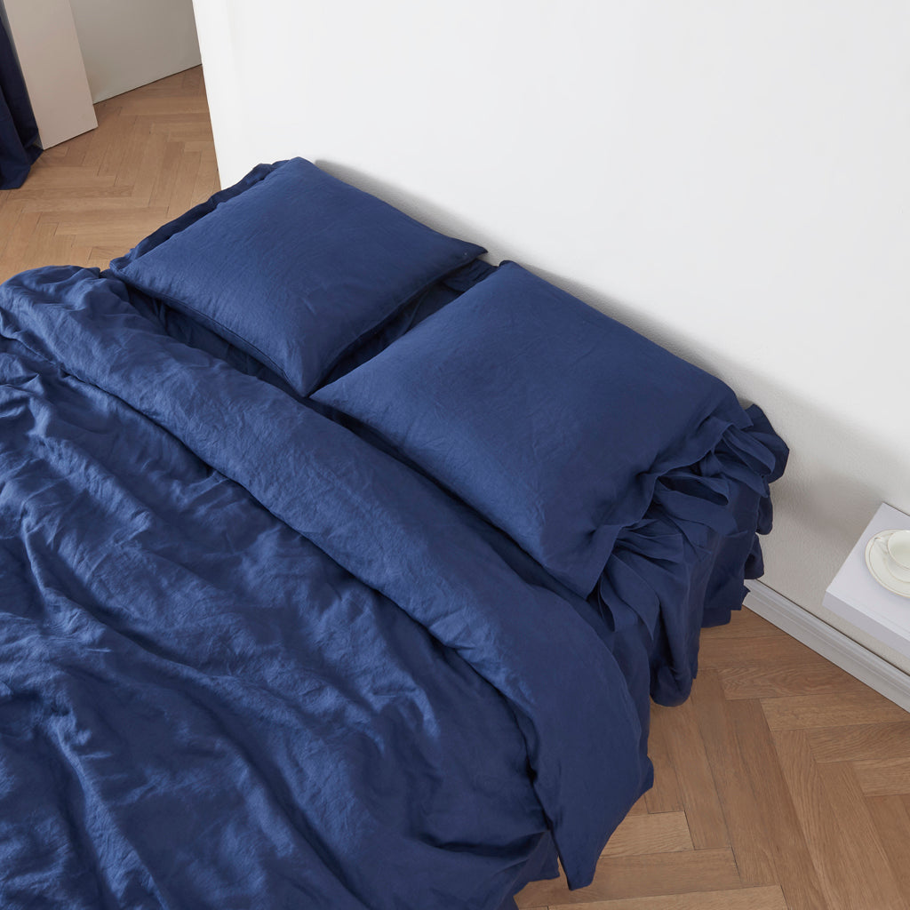 Indigo Blue Linen Euro Pillowcases with Bow Ties On Bed