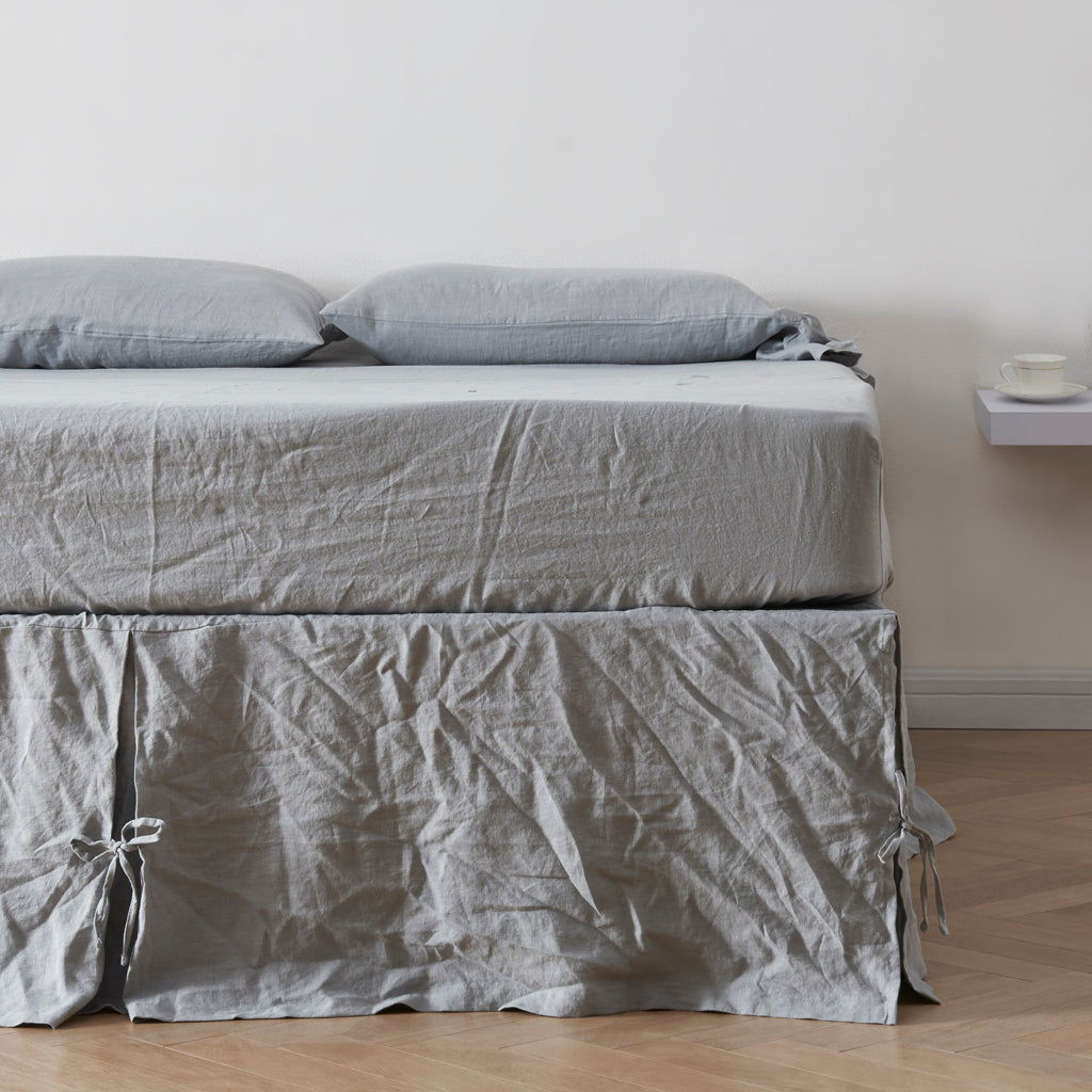 Alloy Gray Linen Pleated Bedskirt With Knots on Bed